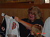 The team mom looking at her new jersey