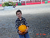 Tyler carrying his heavy pumpkin