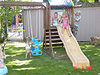 The kids playing on the swings