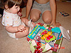 Tyler helping Jordan open her present