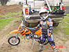 Tyler with new new KTM motorcycle, helmet, gloves, and kneepads