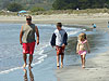 Ken, Tyler, and Jordan walking on the beach