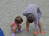 Tyler and Jordan looking through the sand