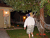 Ken walking to help untangle Tyler from some spiderwebs