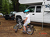 Tyler on his bike by the neighbor's camper