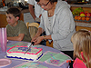 Sylvia helping cut the cake