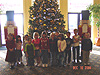 The 1st Grade in front of the Christmas tree in the lobby