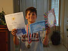Tyler with his certificates for receiving all As all year long