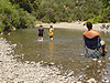 Ken watching the boys play in the creek
