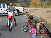 Jordan watching Ken and Tyler check out their bikes