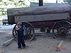 Tyler in front of an old wagon