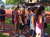 The kids waiting in line to do their long jump