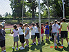 The kids lined up for the softball throw
