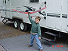 Tyler playing with his glider in front of our trailer