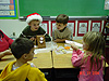 Tyler and his classmates working on the gingerbread house
