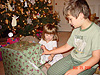 Tyler helping Jordan open another present