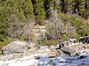 Looking down at the snow on the rocks from above Vernal Falls