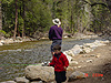 Tyler and Ken fishing by the river