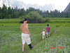 Ken, Jordan, and Tyler walking through a meadow